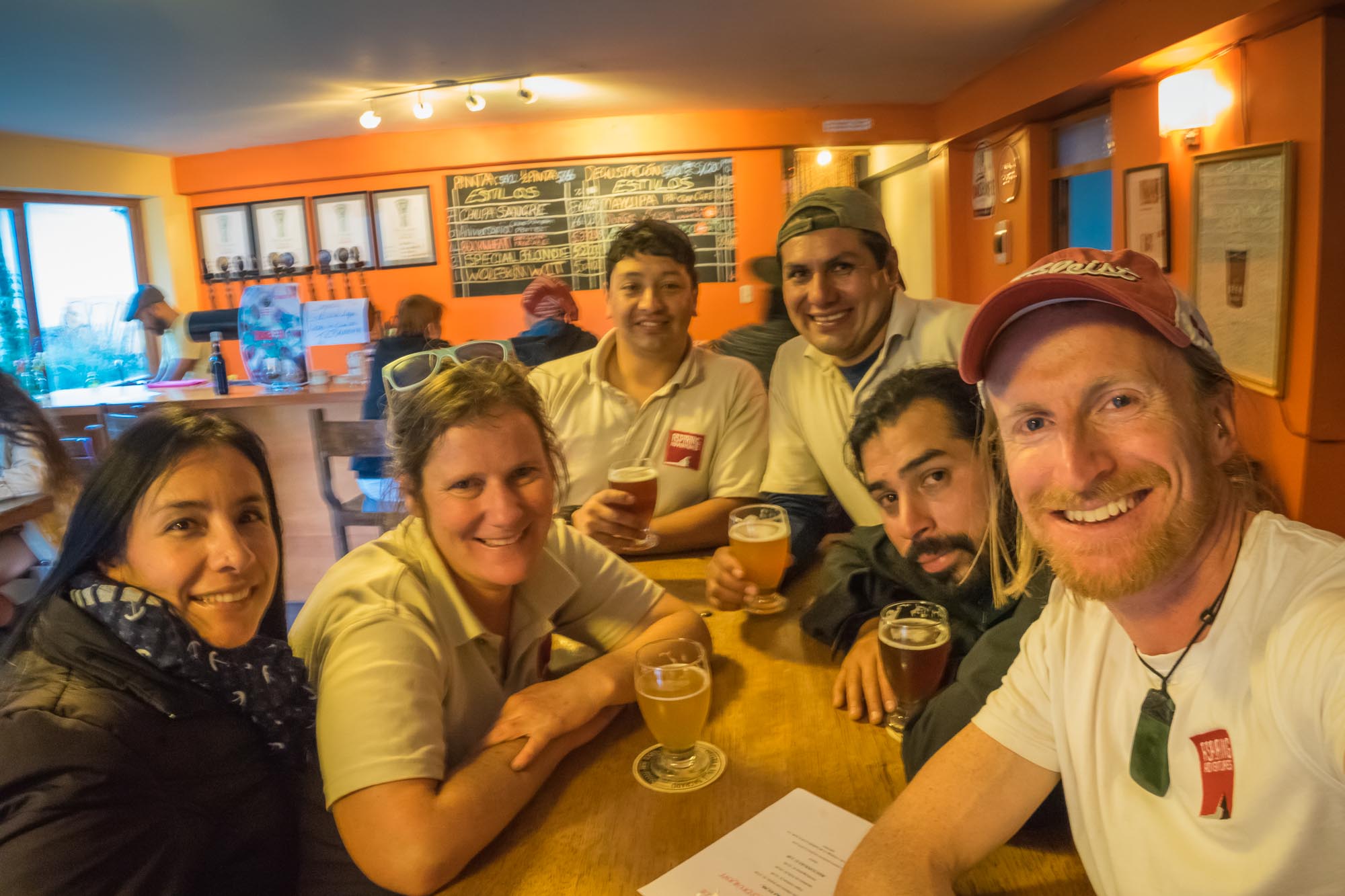 The team enjoys a beer after a day planning new Peru group tours