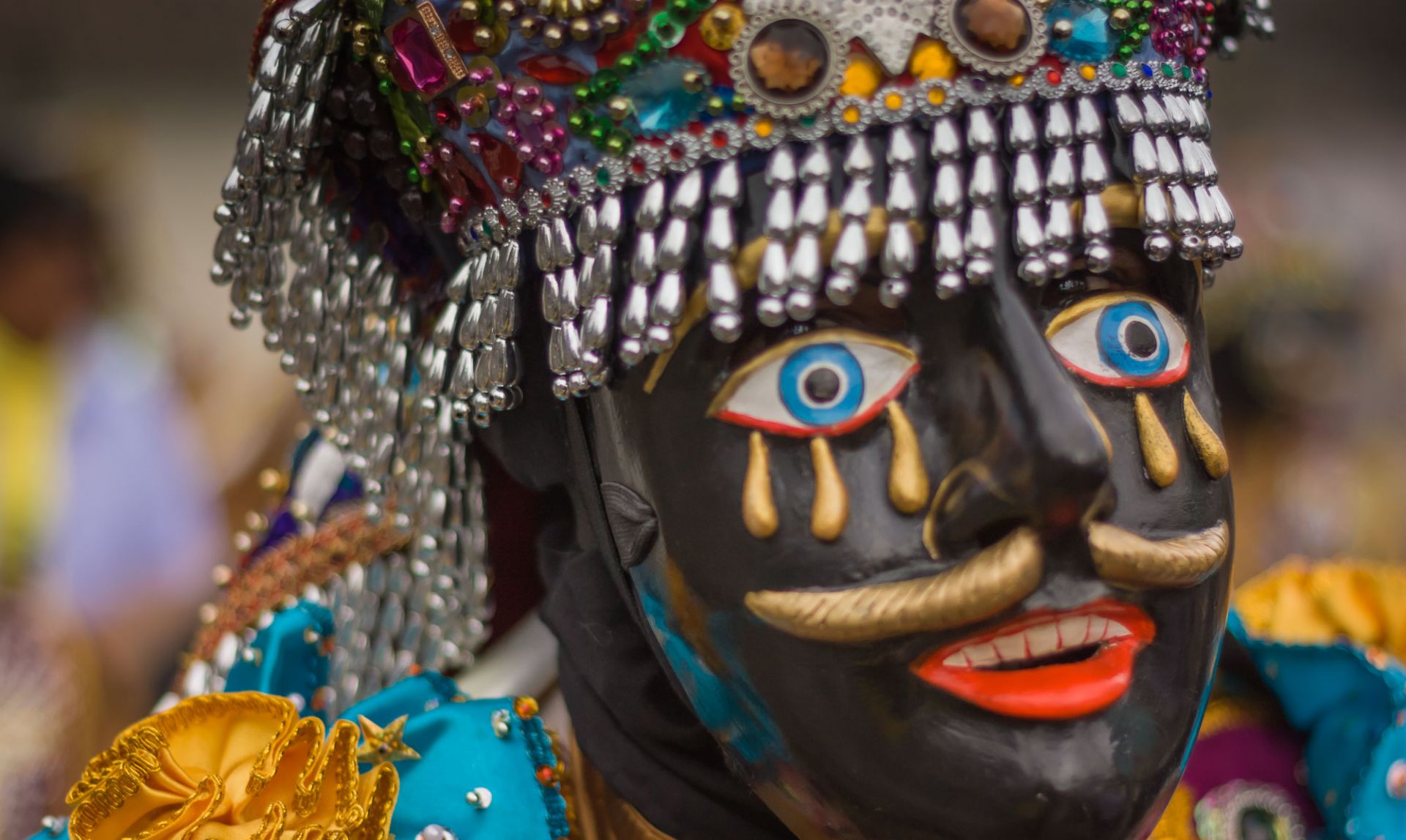 Close-up of man in elaborate negrillo mask, taken on our Paucartambo cultural tour