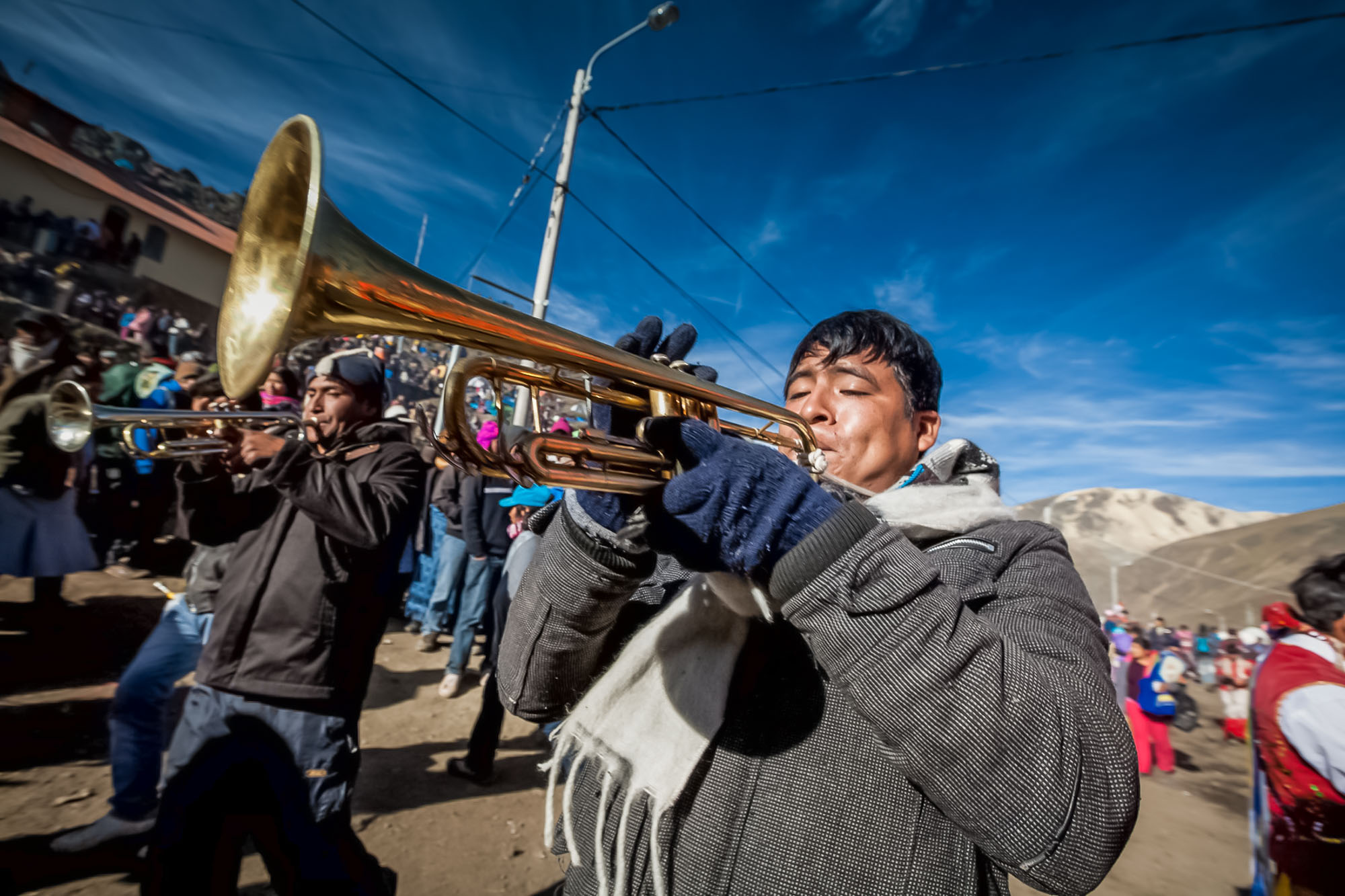Trumpet player in a street parade we watched on a Peru adventure tour