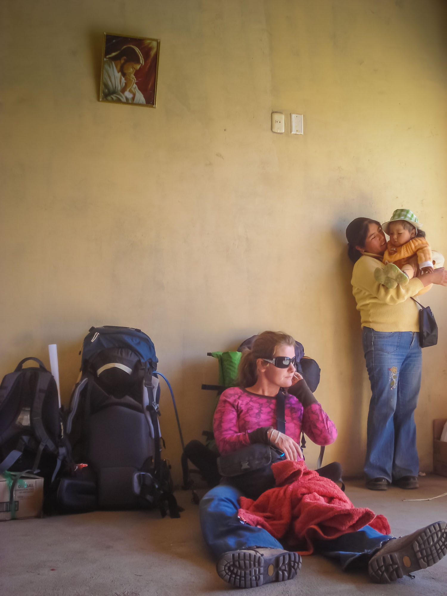Katy waiting for the bus in a tiny village bus terminal – quintessential Peru travel experience